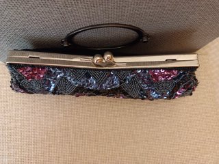Bolso de mano lentejuelas negro y rosa