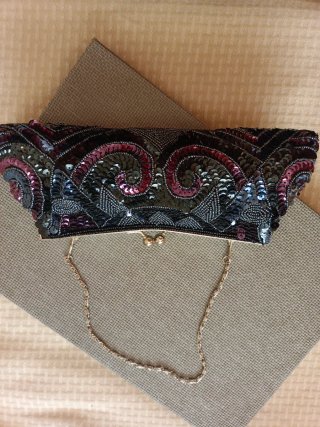 Bolso de mano lentejuelas negro y rosa