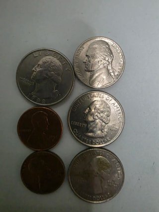 Monedas de colección: 2 Cuartos, 1 Níquel, 2 Centa