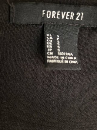 Vestido negro gasa y polipiel corto