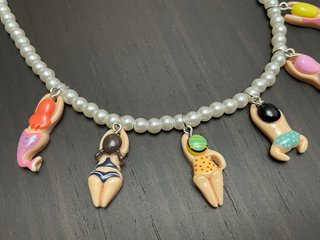 Collar perlas colgantes nadadores