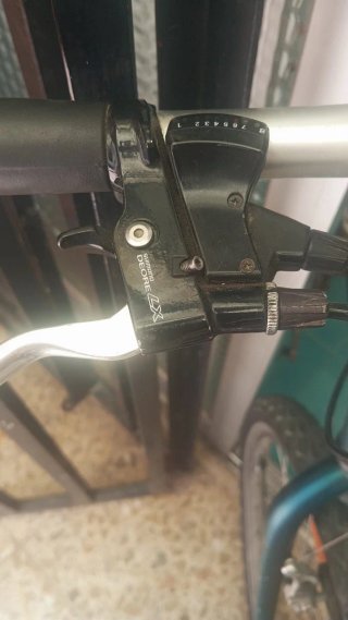 Bicicleta verde con portaequipajes 26p