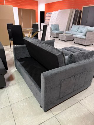 Sofá cama gris de tela