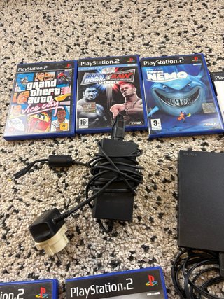Playstation 2 slim with 2 controllers and 15 games