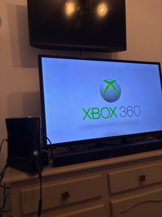 Xbox 360 with 16 games and 2 controllers