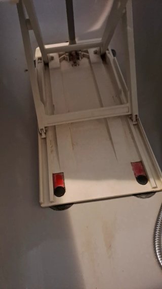 Asiento ducha con mando para cambiar la funda del