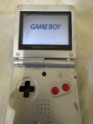 Game Boy Advance SP, con cargador + 8 Juegos