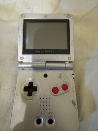 Game Boy Advance SP, con cargador + 8 Juegos