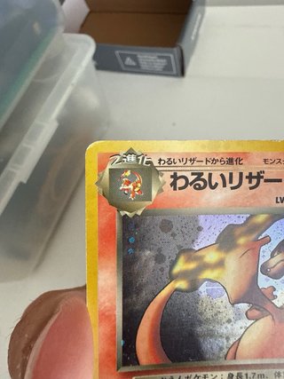 Carta Pokémon Charizard Maligno Rocket