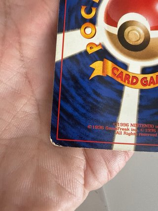 Carta Pokémon Charizard Maligno Rocket