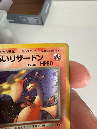 Carta Pokémon Charizard Maligno Rocket