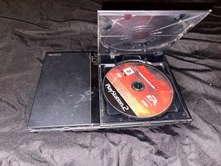 PS2 Slim Sony Nera + Controller, Cavi e Gioco