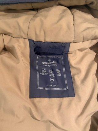Chaqueta gris/azul acolchada con capucha
