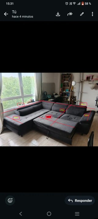 Sofá rinconera gris con cama abatible