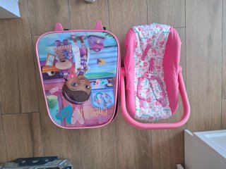 Muñecas en hamaca rosa+ trolley+ropitas