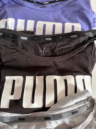 Lote 3 Camisetas Puma: Lila M, Negra S y Negra XS