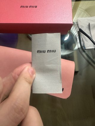 Gafas de sol Miu Miu negras y marrones