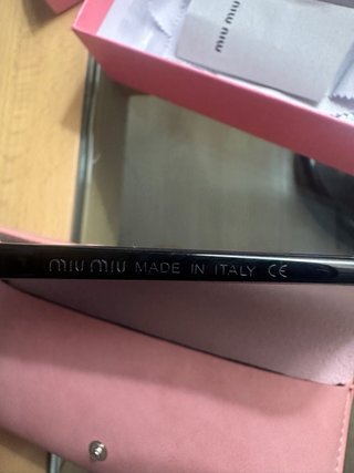 Gafas de sol Miu Miu negras y marrones