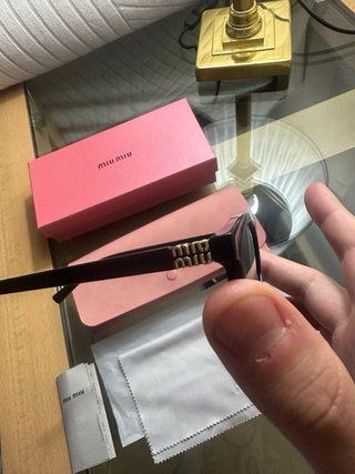 Gafas de sol Miu Miu negras y marrones