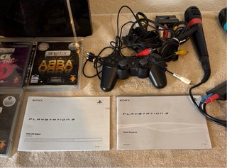 Playstation 3 con 3 juegos Singstar