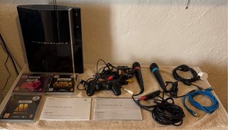 Playstation 3 con 3 juegos Singstar