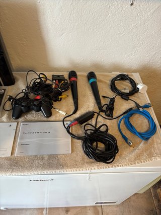 Playstation 3 con 3 juegos Singstar