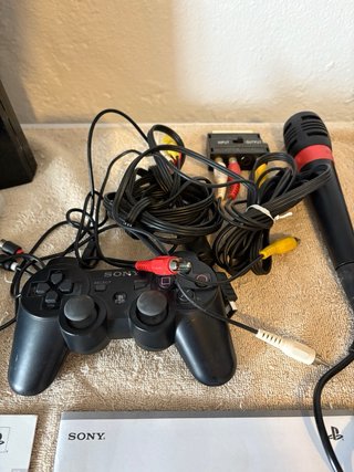 Playstation 3 con 3 juegos Singstar