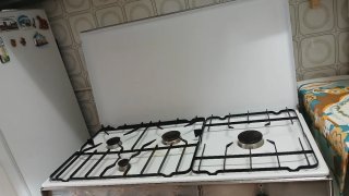 Cocina de gas butano con horno y bombona