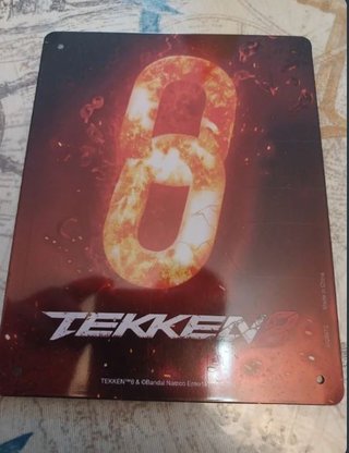 Lotto di videogiochi e placca metallica di Tekken 8