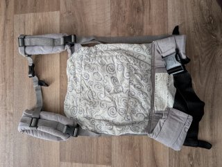 Mochila porteo Ergobaby estrellas gris