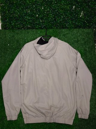Giacca a vento Nike beige e nera