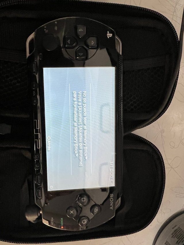 PSP Sony con funda y juego Toy Story 3