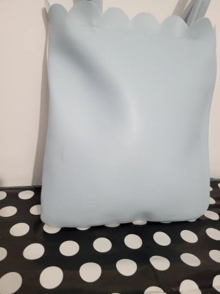 Bolso de mano con estampado floral y musical