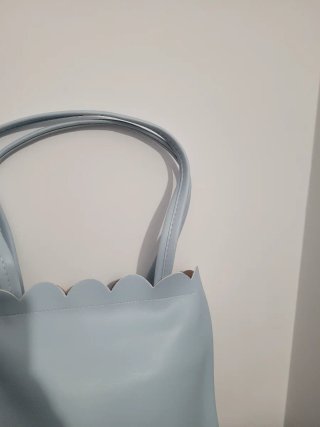 Bolso de mano con estampado floral y musical