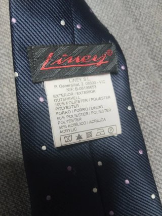 Corbata niño azul con puntos blancos y malva.