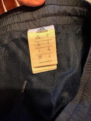 Pantalón chándal Adidas azul y naranja