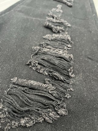 Pantalones negros largos rasgados