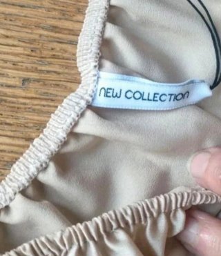 Top corto beige effetto seta