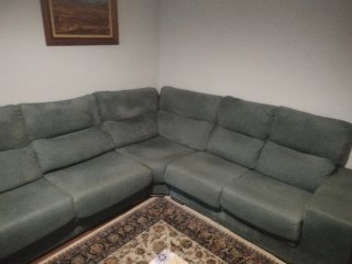 Sofá rinconera verde tela
