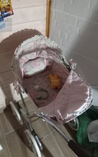 Cochecito de muñecas rosa
