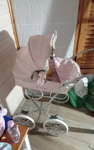 Cochecito de muñecas rosa