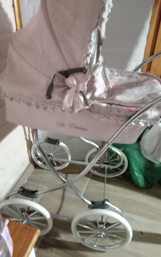 Cochecito de muñecas rosa
