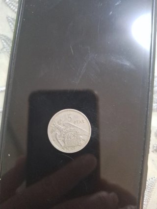 Moneda antigua con retrato