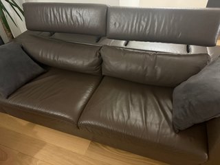 Divano letto in pelle con pouf