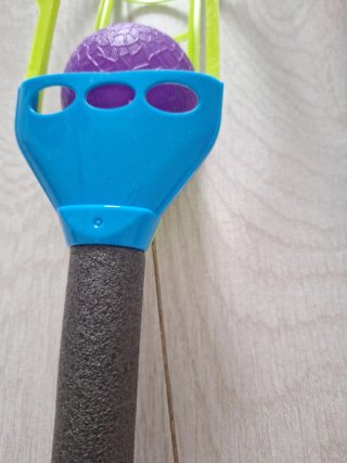 Palas de playa con pelotas