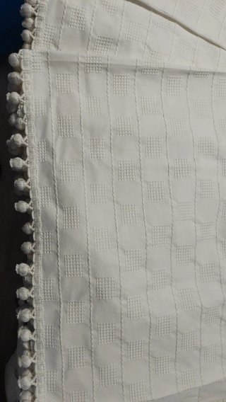 Cortinas beige con pompones