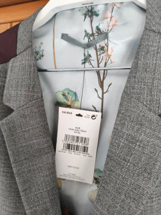 Chaleco gris Next con forro estampado