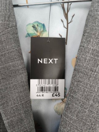 Chaleco gris Next con forro estampado