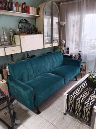 Sofá de terciopelo verde esmeralda