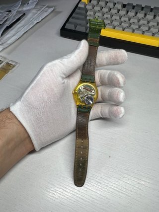 Swatch Reloj Oro y Verde
